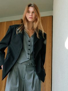 This product is a notched-collar oversized blazer that offers a contemporary twist on a classic design. The oversized cut provides a relaxed and modern silhouette, while the notched lapels keep the piece grounded in traditional tailoring. It's an ideal choice for those who want to make a statement in professional settings or add a touch of sophistication to a casual outfit. - The blazer features a double-button front closure that adds to its structured look, allowing for versatility in styling.- Its large front pockets are both functional and a design element that enhances the oversized nature of the blazer.- The long-line hem of this blazer makes it perfect for pairing with both trousers and skirts for a range of looks.- Constructed from a high-quality fabric, this blazer maintains i Elegant Oversized Single Button Outerwear, Chic Oversized Blazer With Concealed Placket, Elegant Oversized Blazer With Concealed Placket, Elegant Oversized Blazer For Workwear, Elegant Oversized Blazer For Business Casual, Classic Oversized Blazer With Notch Lapel, Chic Oversized Blazer With Notch Lapel, Elegant Oversized Blazer, Oversized Wool Blazer With Notch Lapel