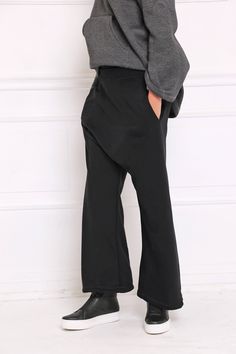 Women Black Pants, Drop Crotch Pants, Palazzo Pants Drop crotch sweatpants in wide leg: |KOMBO| GARMENT FEATURES: * Comfy, cosy, and easy to wear * Drop crotch silhouette * Wide leg fit * Elasticated waist * Practical side pockets * Made from quality sweatshirt cotton jersey COLOUR OPTIONS: This product is available in the following color options: - black; - graphite grey; - light grey; - navy; - white. SIZE & FIT: Model is 175cm tall and wears size S. COMPOSITION: Main: 100% cotton GARMENT Black Wide Leg Yoga Pants For Work, Black Stretch Wide-leg Yoga Pants, Black Straight Leg Harem Pants For Fall, Black Wide-leg Sweatpants, Black Stretch High-waisted Parachute Pants, Black Baggy Wide-leg Sweatpants, Black Straight Leg Yoga Pants With Pockets, Black Baggy Straight Sweatpants, Stretch Wide Leg Straight Pants For Streetwear