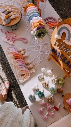 a table topped with lots of different types of candies next to a sign that says happy birthday