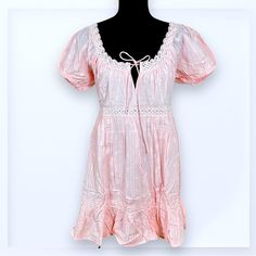 Nwt - Size Small -Ruffled Babydoll Dress From Lulu’s. -Light Pink With Subtle Stripes And Polkadot Pattern -Puff Sleeves With Elastic Around Openings -Notched Neckline Ties In Front -Fully Lined (Except For The Sleeves) -Shell: 100% Cotton, Lining: 100% Cotton **Approximate Flat Lay Measurements** Underarm To Underarm: 18” Waist: 16.5” Length - Shoulder To Hem: 33” Bundle To Save! Reasonable Offers Always Welcome. Cute Mini Dress With Lace Trim And Short Sleeves, Cute Ruffled Mini Dress For Daywear, Cute Cotton Mini Dress With Lace Trim, Pink Short Sleeve Mini Dress With Lace Trim, Pink Mini Dress With Lace Trim And Short Sleeve, Flowy Cotton Mini Dress With Lace Trim, Notched Neckline, Lulu Dresses, Polka Dot Pattern