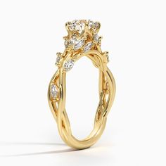 a yellow gold ring with two diamonds on it