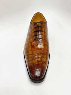 Style: 503-67E-Cognac Unique Crocodile Printed Embossed Calfskin lace-up Oxford from our Carrucci by Maurice collection features soft Calfskin lining, a clean welt, and a Rubber Sole! Lace-up Leather Shoes With Crocodile Pattern, Brown Oxfords With Crocodile Pattern And Round Toe, Brown Crocodile Pattern Oxfords For Formal Occasions, Brown Crocodile Pattern Formal Oxfords, Brown Crocodile Pattern Oxfords With Plain Toe, Formal Lace-up Leather Shoes With Crocodile Pattern, Classic Brown Oxfords With Crocodile Pattern, Brown Crocodile Pattern Leather Shoes For Semi-formal Occasions, Brown Crocodile Pattern Leather Shoes For Semi-formal