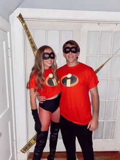 a man and woman dressed up in costumes