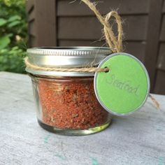 a jar filled with spices sitting on top of a table