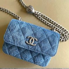 Chanel Clutch With Chain Clutch Silver Chain Denim With Camellia Print Silver-Tone Metal Blue And Silver Brand New! Dimensions 3.7x4.9x1.4 In Chain Adjustable 24-47.835 In Include Chanel Box, Dust Bag, Camellia, Ribbon Luxury Blue Bag With Chain Detail, Luxury Blue Bags With Chain Detail, Luxury Blue Bags With Chain, Elegant Blue Bag With Chain Detail, Luxury Blue Chain Bags, Denim Chanel Bag, Chanel Clutch With Chain, Chanel Clutch Bag, Denim Chanel