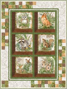 a quilt with pictures of animals in the center and on it's sides, surrounded by pine needles