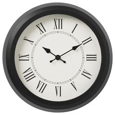 a black and white clock with roman numerals on it's face is shown