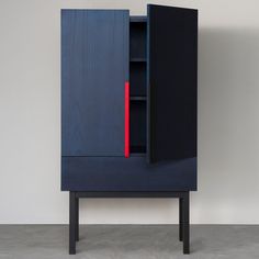 a blue cabinet with a red strip on the door