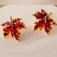 New Rhinestones Maple Leaf Stud Earring Shiny Red Gold Tone Fall Autumn Firey Maple Leaf Red Orange Rhinestone Fall Autumn Gold Tone Stud Earrings Red Gold Plated Earrings For Festivals, Red Crystal Earrings For Anniversary, Festive Red Gold-plated Earrings, Maple Leaf Jewelry, Maple Leaf Earrings, Elegant Gold Plated Leaf-shaped Earrings, Garnet And Gold, Fancy Gifts, Square Earrings Studs