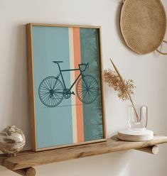 a wooden shelf with a painting and vase on it