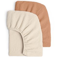 two pillows on top of each other in brown and beige colors, one with a ruffled