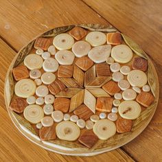 a wooden plate filled with different types of buttons