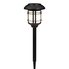 a black post light with a white light on it's top and side panel