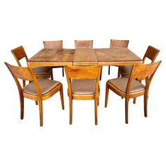 a wooden table with six chairs around it