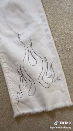 a white towel with black ink on it