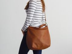 "THE SIZE SHOWN IN PICTURES IS THE LARGE HOBO BAG. This tan soft leather bag from the HELEN collection is our most popular product as it is also a stylish women laptop bag. A feminine and modern large lightweight leather bag designed with plenty of storage space and organiser pockets is a must have purse for every women. Ideal for any occasion and any style you can wear this tan hobo purse short on the shoulder or using the long strap you can go with a casual style and hands - free. That makes a Soft Leather Hobo Bag For Fall, Fall Leather Hobo Bag, Fall Soft Leather Hobo Bag For Everyday, Everyday Hobo Bucket Bag With Adjustable Strap, Fall Hobo Satchel Bag For Everyday Use, Fall Satchel Hobo Bag For Everyday Use, Fall Hobo Bag, Fall Hobo Bag With Leather Handles, Everyday Fall Hobo Bag