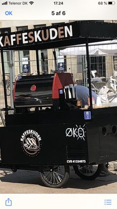 a food cart parked in front of a building