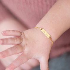 If you're looking for a creative and special gift for toddlers and children, this beautiful, engravable plain rectangular identification tag bracelet is a meaningful gift for any event. Entirely crafted in 14k Yellow Gold, which is safe for babies and children's everyday wear. Order a traditional ID bracelet today and we'll neatly package it into its own lovely gift box. Personalized Yellow Gold Rectangular Name Bracelet, Personalized Rectangular Yellow Gold Name Bracelet, Personalized Nameplate Gold Bracelet, Personalized Rectangular 14k Gold Bracelets, Rectangular Engraved Gold Bracelet Gift, Personalized Adjustable Nameplate Gold Bracelet, Yellow Gold Rectangular Name Bracelet As Gift, Rectangular Yellow Gold Name Bracelet For Gifting, Customizable Gold Nameplate Bracelet For Personalized Gift