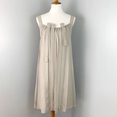 Excellent Pre-Owned Condition! Sleeveless Silk Dress With Tie Straps, Knee-length Daywear Dress With Tie Straps, Sleeveless Beige Mini Dress For Daywear, Beige Pleated Sleeveless Dress For Summer, Spring Silk Dress With Tie Straps, Knee-length Dress With Tie Straps For Daywear, Spring Silk Dresses With Tie Straps, Silk Dresses With Tie Straps For Spring, Spring Sleeveless Silk Midi Dress