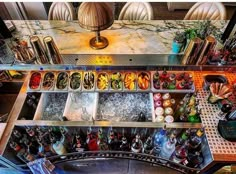 an overhead view of a kitchen with many items on the counter and below it is a chandelier