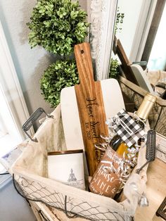 a basket filled with wine bottles and other items