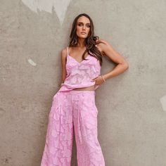 Step out in our exquisite "Phoebe" Pink Palazzo Pants! Ideal for resort and cruise wear, or maybe you have a beach wedding to go to? Team them back with our "Iris" Cami top for an elevated evening look or mix and match with other block colours in your wardrobe. Wear with a white or black jacket for a classic feminine look or style back with a funky denim jacket. Be different, be glamorous, be pretty in pink! 100% Viscose Embossed Georgette Gentle machine wash in cold water, drip dry, cool iron o Summer Party Wide Leg Bottoms, Feminine Summer Evening Bottoms, Elegant Pink Bottoms For Vacation, Elegant Spring Vacation Pants, Chic Pink Pants For Vacation, Feminine Summer Wedding Bottoms, Pink Summer Wedding Bottoms, Feminine Bottoms For Spring Evening, Feminine Evening Bottoms For Spring