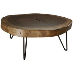 a wooden table with hairpin legs and a round wood tray on it's top