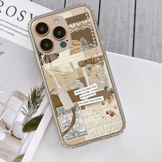 an iphone case with some pictures and writing on the back, sitting on top of a table