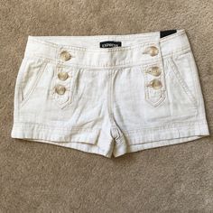 Express Button Shorts. Size. 00. New Summer Button-up Bottoms For Day Out, Beige Summer Pants With Buttons, Summer Beige Pants With Buttons, Cotton Button-up Bottoms For Day Out, White Bottoms With Snap Buttons For Spring, Spring White Bottoms With Snap Buttons, White Snap Button Bottoms For Spring, Trendy Button-up Summer Bottoms, Spring Bottoms With Snap Buttons For Day Out