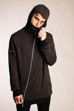 ► GARMENT ◄- Relaxed fit hoodie- High neck that covers the nose and mouth when fully zipped- Asymmetrical front zip- 2 zip pockets at waist- 2 mini zip pockets at bicep- Fully lined in either dusty blue or stone- Charcoal gray body with black cuffs and hem- Fitted hood► FABRIC ◄This garment is made from 100% organic cotton. This impeccably soft and comfortable organic cotton jersey is GOTS certified. Because real style goes beyond what you wear.► CARE ◄Our garments are made utilizing unique dye Black Hooded Jacket With Zip Cuffs, Hooded Winter Track Jacket With Zip Cuffs, Winter Hooded Track Jacket With Zip Cuffs, Techwear Track Jacket With Zip Cuffs, Long Sleeve Hoodie With Ykk Zipper For Fall, Urban Long Sleeve Track Jacket With Zip Cuffs, Fall Long Sleeve Hoodie With Ykk Zipper, Winter Long Sleeve Sweatshirt With Ykk Zipper, Streetwear Hoodie With Zip Cuffs And Long Sleeves