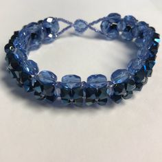 Artisan Made Blue Flower Beaded Bracelet Nwot 7 1/2” Long. Gorgeous Bracelet!! Elegant Blue Hand-strung Crystal Bracelet, Blue Crystal Bracelet With Spacer Beads, Elegant Adjustable Blue Crystal Bracelet, Elegant Blue Beaded Crystal Bracelet, Blue Beaded Bracelets With Spacer Beads For Party, Blue Beaded Crystal Bracelet With Round Beads, Blue Beaded Crystal Bangle Bracelet, Adjustable Blue Crystal Bracelet With Large Beads, Blue Crystal Bracelet With Large Adjustable Beads