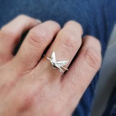 A handmade stacking ring with a delicate flying bird. This ring is intended to capture the wonder and peace that watching and interacting with our feathered friends can bring. Wear your bird charm ring alone for a dainty, feminine look, or stack with our other designs for extra (as shown in the last two images). This bird ring would make a great gift for someone, as they can add to their collection each year on a birthday or anniversary.  Cast from 100% recycled gold and silver in the UK Availab Flying Pose, Silver Bird Ring, Bird Ring, Bird Flying, Bird Rings, Charm Ring, Silver Bird, Feather Ring, Flying Bird