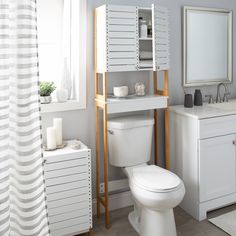 This Organize It All Over the Toilet Space Saver Cabinet is stylish and functional for almost any bathroom. It adds 3 additional storage shelves to an otherwise unused area of the bathroom; above the toilet. This cabinet is perfect for storing toilet paper, towels, and other bathroom essentials out of sight. The bamboo frame and the white cabinet are very modern and will look great in your space. Organize It All White 3-Tier Wood Freestanding Bathroom Shelf (23.62-in X 70.47-in X 10.24-in) | NH- Toilet Furniture, Freestanding Bathroom Shelves, Over Toilet Storage, Over The Toilet Storage, Over The Toilet Cabinet, Over The Toilet, Bathroom Oasis, Over Toilet, Boho Bathroom