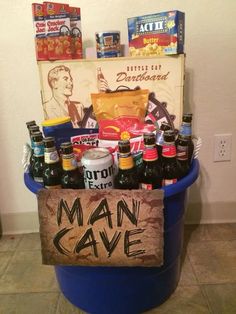 a man cave gift basket with beer and snacks in a blue pail on the floor