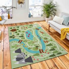 a living room filled with furniture and a rug on top of a hard wood floor