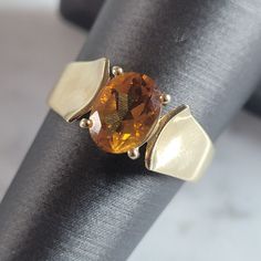 A Womens Vintage Estate 14k Yellow Gold Ring With A Beautiful Citrine Colored Stone. Not Sure If The Stone Is Real Or Simulated. The Ring Weighs 3.4g And Is A Size 7.0. Ring Is Marked "14k,585". Any Questions Please Do Not Hesitate To Ask. Be Sure To Check Out Some Of My Other Great Items Up For Sale. Thank You. Citrine Gold Ring, Classic 14k Gold Orange Jewelry, Classic Orange 14k Gold Jewelry, Classic Orange Rings With Polished Finish, Classic Yellow Gold Diamond Cut Topaz Ring, Classic Yellow Gold Topaz Ring With Diamond Cut, Classic Yellow Gold Topaz Gemstone Ring, Classic Orange Topaz Ring With Prong Setting, Classic Orange Topaz Ring For Anniversary