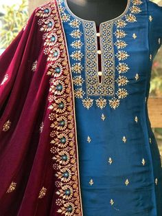 Item Overview ATHARVA Hand Embroidery Salwar Kameez/Chanderi Shirt/Embroidery Neck/Blue/Tilla Work Maroon Velvet Dupatta/Custom Stitch Unstitch Dno. VL09B Fabric: * Shirt - Chanderi Silk- Hand Embroidered Neck- 2.5 Mts /Bootis all over * Dupatta: Embroidered Velvet Dupatta- 4 Side Border Embroidery - 2.5 Mts- Latkans Tassels - * Bottom Santoon Silk 2.5 Mts. Excusive Hand Embroidered Party Wear Punjabi Suit. Customization: * Fabrics Customization: Designs Can be made in different Fabrics. *Color Dola Silk Anarkali Set With Embroidered Border, Embroidered Raw Silk Sharara With Straight Kurta, Dola Silk Straight Kurta With Embroidered Border, Straight Dola Silk Kurta With Embroidered Border, Embroidered Chinon Sharara For Diwali, Transitional Embroidered Art Silk Sharara, Designer Blue Sharara With Embroidered Border, Blue Dola Silk Kurta With Pallu, Traditional Sharara With Dori Work For Eid