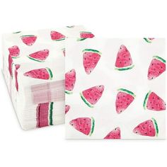 paper napkins with watermelon slices on them, one in white and the other in pink