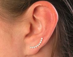 This beautiful pair of ear crawlers made with sterling silver. Each ear crawlers/climbers are set with CZ stones. The extended wire sits behind the lobe to secure the earring in place. Stamped '925'. Size: 20mm x 2.5mm Priced per pair Silver Ear Climbers, Ear Crawlers, Ear Climber, Ear Climbers, Cz Stone, Wholesale Jewelry, Beautiful Bracelet, Jewelry Findings, Semiprecious Stones