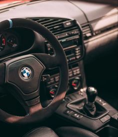 the steering wheel and dashboard of a car