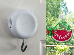 a watermelon sign hanging from the side of a door