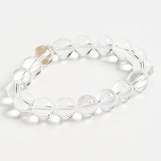 Our elegant glass bracelet adds a touch of class to any outfit. The perfect accessory for any occasion. Feel fabulous wearing this timeless piece. Transparent glass beads Elastic band Sterling with Gold Plate Transparent Beads Bracelet, Adjustable Clear Bangle Jewelry, Modern Beaded Bracelets For Formal Occasions, Elegant Adjustable Crystal Stretch Bracelet, Elegant Round Bracelets With Faceted Beads, Elegant Bracelet With Round Faceted Beads, Adjustable Clear Bangle Bracelets, Adjustable Clear Bangle Bracelet, Elegant Crystal Beaded Bracelets With Faceted Details