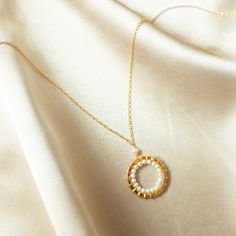 Make it your modern classic go-to for an instant style boost. This version of our signature necklace features beautiful freshwater pearls that make for perfect layering and everyday wear. Our delicate chain has the look of spun gold and is handmade with 14k gold plated over fine Italian silver and a secure spring ring clasp. Adjustable length is 16-18" with a 2" extension chain. Elegant Full Circle Delicate Chain Necklace, Elegant Handmade Circle Necklaces, Elegant Full Circle Handmade Jewelry, Circular Pearl Pendant Jewelry Gift, Infinity Necklace Gold, Halo Collection, Signature Necklace, Bespoke Gifts, Infinity Necklace