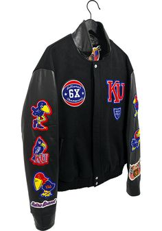 Add a layer to your gameday look with this Kansas Jayhawks Black Jeff Hamilton Basketball Leather Heavyweight Jacket! Stay warm in cooler weather as you cheer on the Jayhawks in this great Winter Coat. With a embroidered team graphics on chest, back, and sleeves, you'll be the most comfortably warm and stylish while at the game. Two front pockets, Rib-knit collar, cuffs and waistband, Full Snap, Vegan leather, Jeff Hamilton design, Embroidered graphics, Imported Sporty Winter Outerwear For Game Day, Black Long Sleeve Outerwear For Game Day, Casual Black Outerwear For Game Day, Black Varsity Jacket For Game Day In Winter, Black Varsity Jacket For Game Day In Fall, Black Winter Varsity Jacket For Game Day, Urban Outerwear For Game Day In Fall, Urban Style Outerwear For Game Day In Fall, Team-colored Outerwear For Game Day In Fall