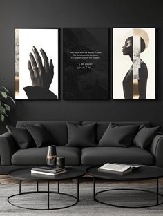 a living room with two black and white paintings on the wall next to a coffee table