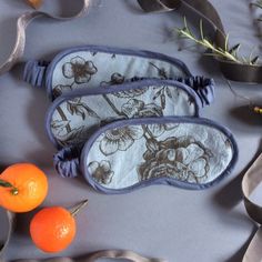 "The Botanical eye mask is a perfect pampering self-care gift for someone special, including yourself! It is handmade in eco-friendly Oeko-Tex certified cotton and slightly cushioned for extra comfort.  This eye mask is part of the Botanical collection, made in a cornflower blue cotton with a botanical print in black, it is slightly cushioned with a 100% cotton batting, layered with cotton fabric to block out the light and backed with a soft bamboo and cotton jersey. The mask is edged with a sil Silk Sleep Mask, Sleep Masks, Botanical Collection, Bamboo Silk, Botanical Print, Cornflower Blue, Gift List, Gift Handmade, Sleep Mask