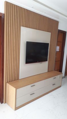 a flat screen tv mounted to the side of a wall