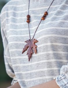 Experience the natural beauty of autumn with these handmade maple leaf necklaces with an adjustable knot. Made with careful attention to detail, each pendent showcases the beautiful gradient of fall colors, ranging from deep burgundy to warm orange. Perfect for nature enthusiasts and those who adore seasonal accessories, these unique necklaces are ideal for everyday wear or special occasions.  The unique design adds a touch of elegance and earthiness to any outfit, making them a perfect gift for Handmade Jewelry For Fall, Brown Jewelry For Fall Season Gift, Brown Jewelry Gift For Fall, Brown Jewelry For Fall Gifts, Brown Adjustable Necklace For Gifts, Brown Necklace With Adjustable Length For Gifts, Brown Necklace With Adjustable Length As Gift, Gift Necklace With Adjustable Length In Brown, Bohemian Adjustable Jewelry For Fall