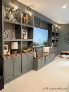 a living room filled with lots of gray furniture