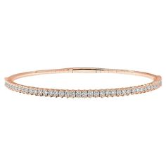 . This 14kt rose gold bangle tennis bracelet is the epitome of grace and charm. Encircling your wrist in a delicate and feminine embrace, it shimmers with an unbroken circle of round-cut diamonds, exuding a timeless allure. The warm and romantic hue of rose gold enhances the bracelet's elegance, creating a harmonious fusion of luxury and femininity. Every facet of this bracelet is a testament to the enduring beauty of diamonds, making it a symbol of enduring love and sophistication. Wearing this Rose Gold Bangle, Gold Bangle, Diamond Bangle, Rose Gold Diamonds, Tennis Bracelet, Round Cut Diamond, Gold Bangles, Or Rose, Round Diamonds